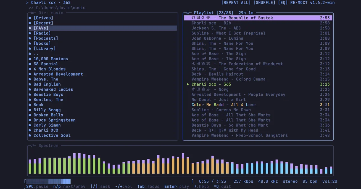 RE-MOCT in a terminal: the music folder browser, a playlist with the current track highlighted, and the spectrum visualizer